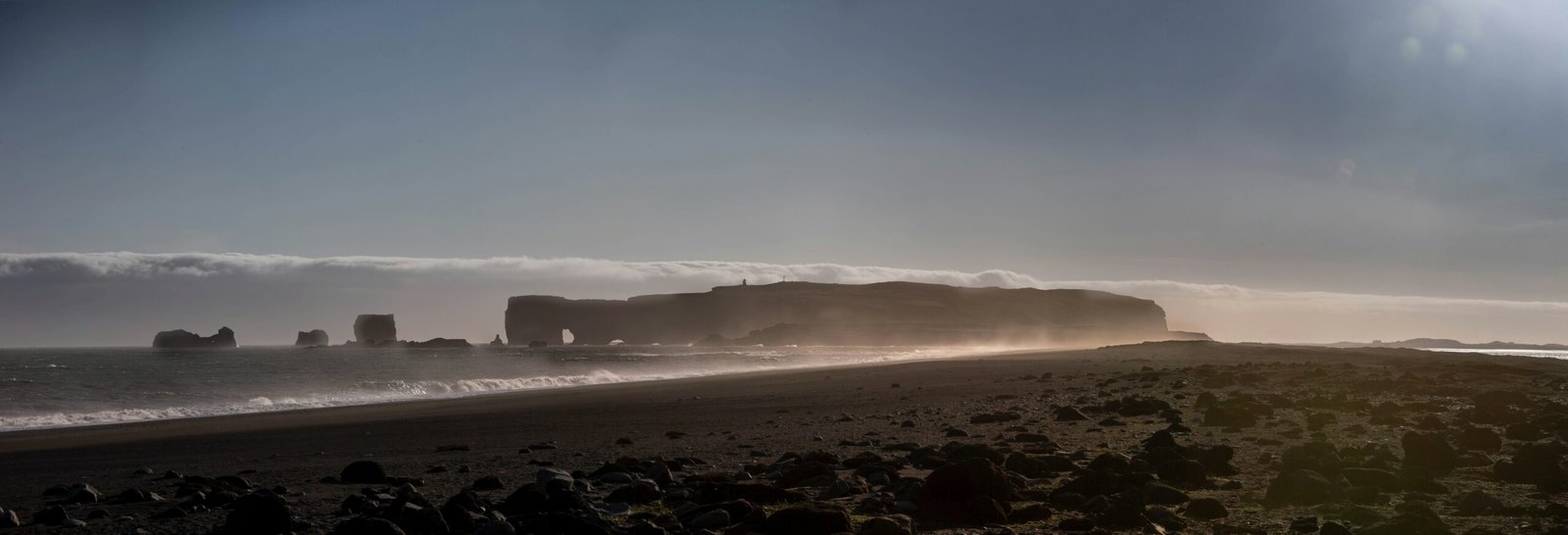 How overlying dust alters North Atlantic low clouds