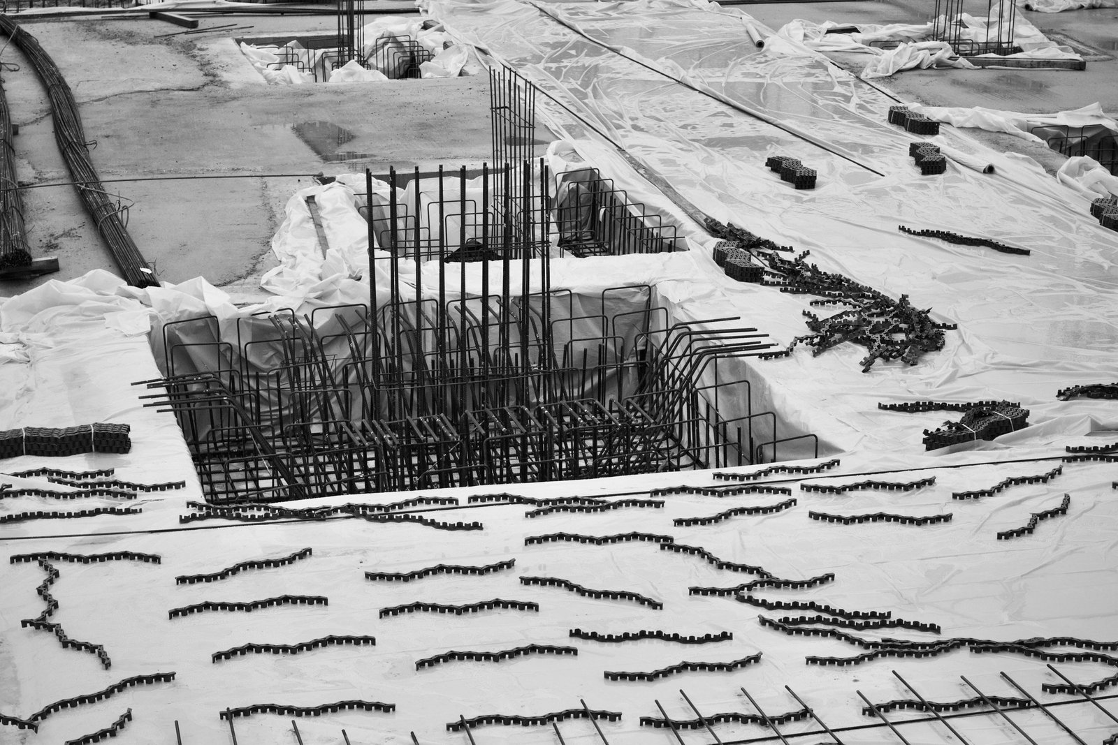 Out-of-plane behavior of masonry walls strengthened with full-length injected tie-rods