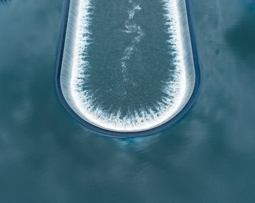 Vertical vibration changes regolith flow but lowers average discharge rate