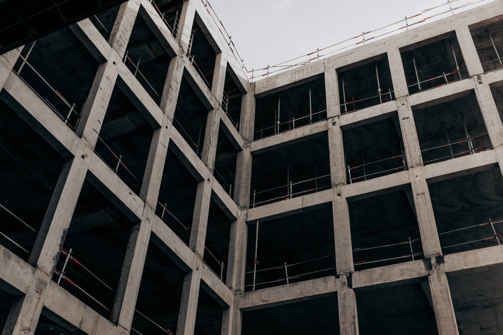 Advanced single-strut modelling of lightweight in-filled RC frames: validation and seismic performance assessment